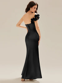 Black strapless formal dress with fishtail and ruffles.