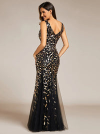 Black and gold formal dress with fishtail and sequins.