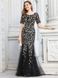 Black and gold Mother of the bride or formal dress, short sleeve with tulle, lace and sequin detailing.