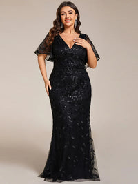Black Plus Size Mother of the bride or formal dress with tulle, sequins and lace ruffle sleeves.