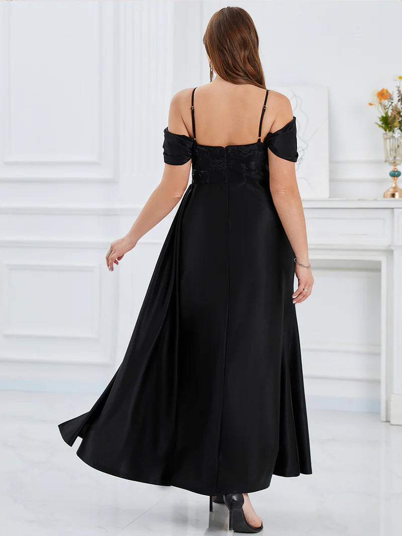 Black plus size formal dress with colder shoulder corset style and split.
