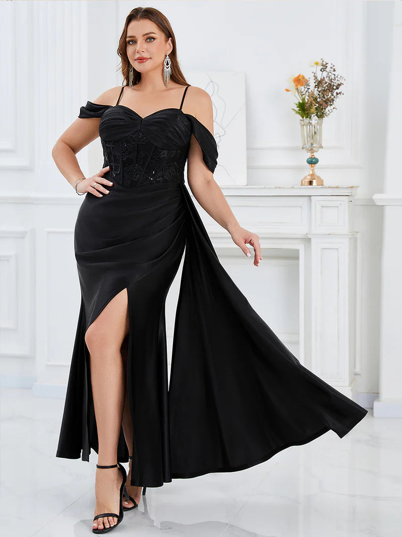 Black plus size formal dress with colder shoulder corset style and split.