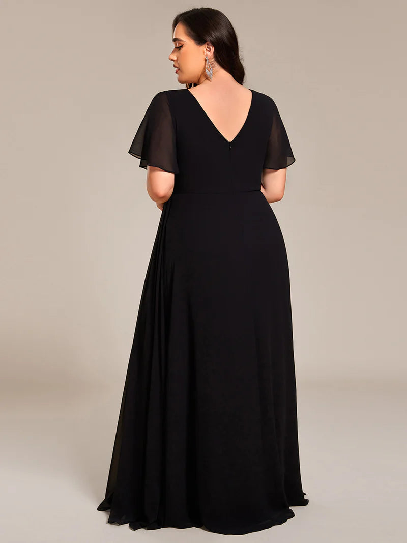 Black plus size formal dress with sleeves and a hidden split.