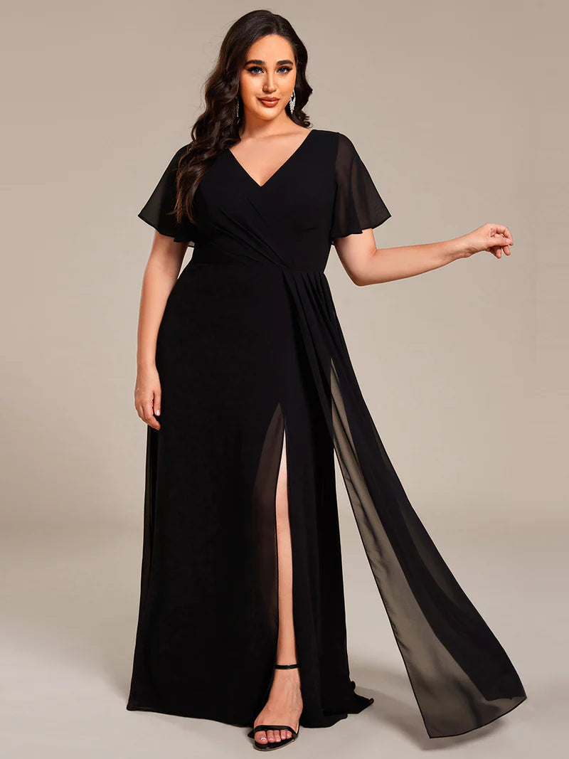 Black plus size formal dress with sleeves and a hidden split.