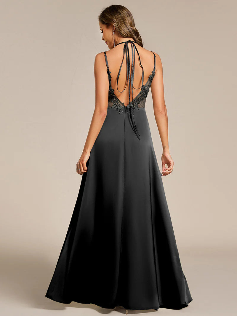 Black satin bridesmaid dress in A-line style with spaghetti straps and lace up back detail.
