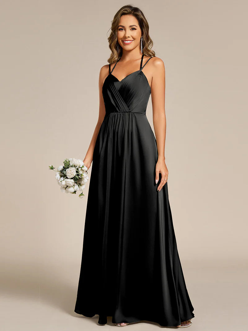 Black satin bridesmaid dress in A-line style with spaghetti straps and lace up back detail.