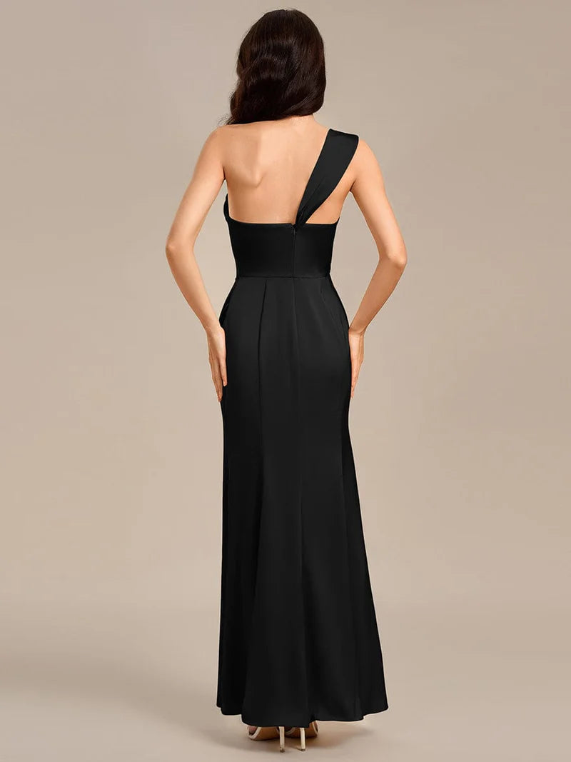Black satin formal dress or bridesmaid dress in an off shoulder  design with a split.
