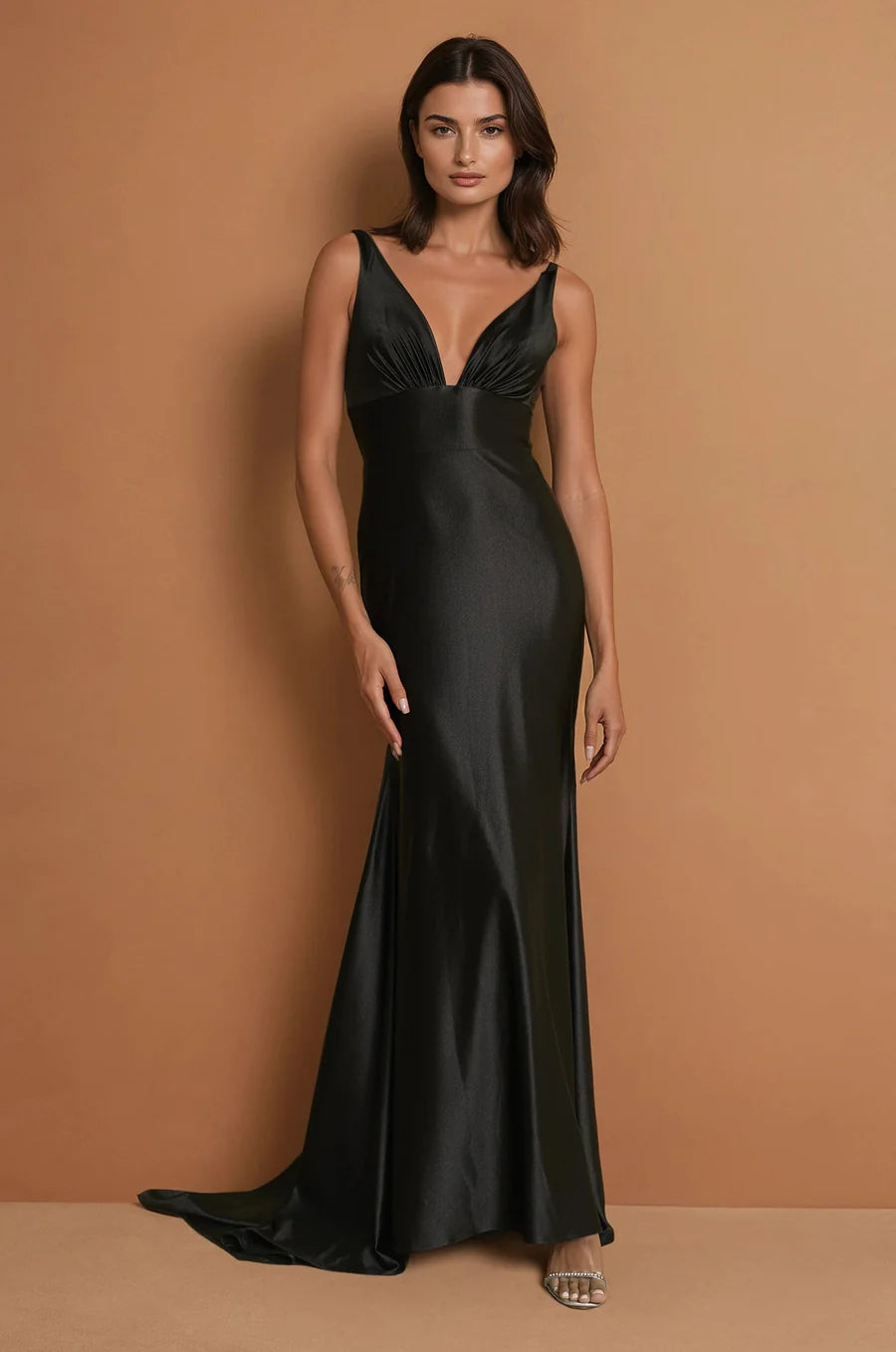 Black satin formal dress with low back and mermaid train.
