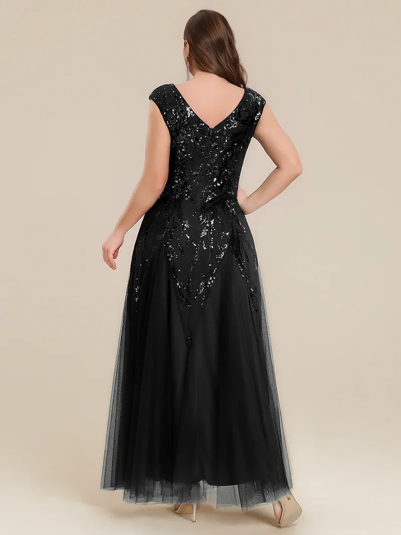 Black sequin and tulle mother of the bride dress with short sleeve.