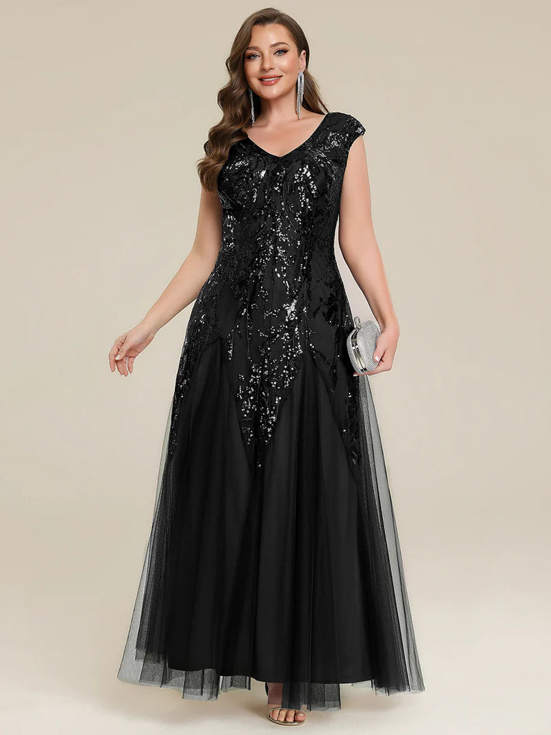 Black sequin and tulle mother of the bride dress with short sleeve.