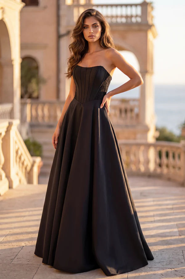 Black strapless plus size formal dress with lace up back.