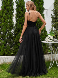Black wedding dress with beaded bodice, tulle skirt and spaghetti straps.