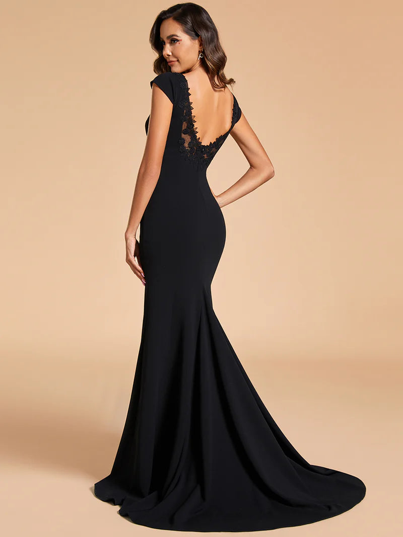 Black wedding dress with cap sleeves and mermaid train.