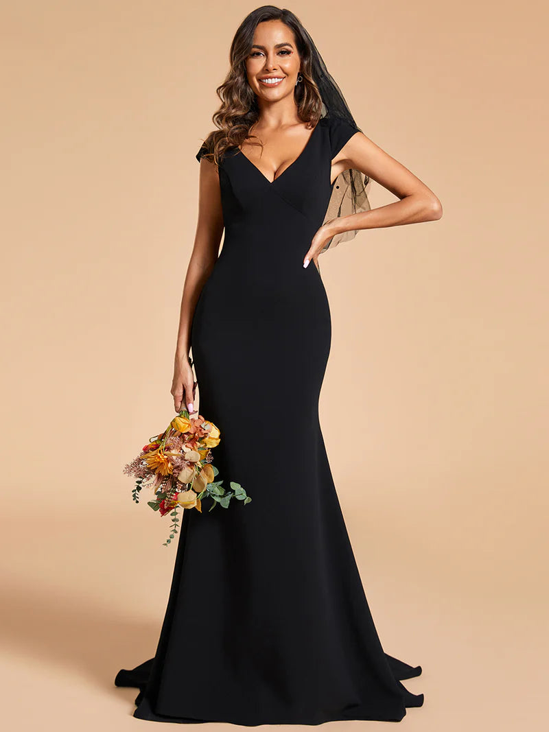 Black wedding dress with cap sleeves and mermaid train.