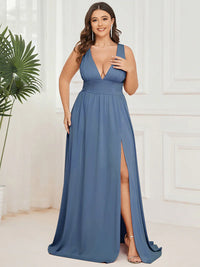 Plus sized dusty blue bridesmaid dress with sleeveless and deep v-neck.