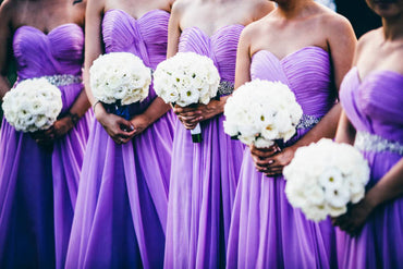 purple bridesmaid dresses with white flowers