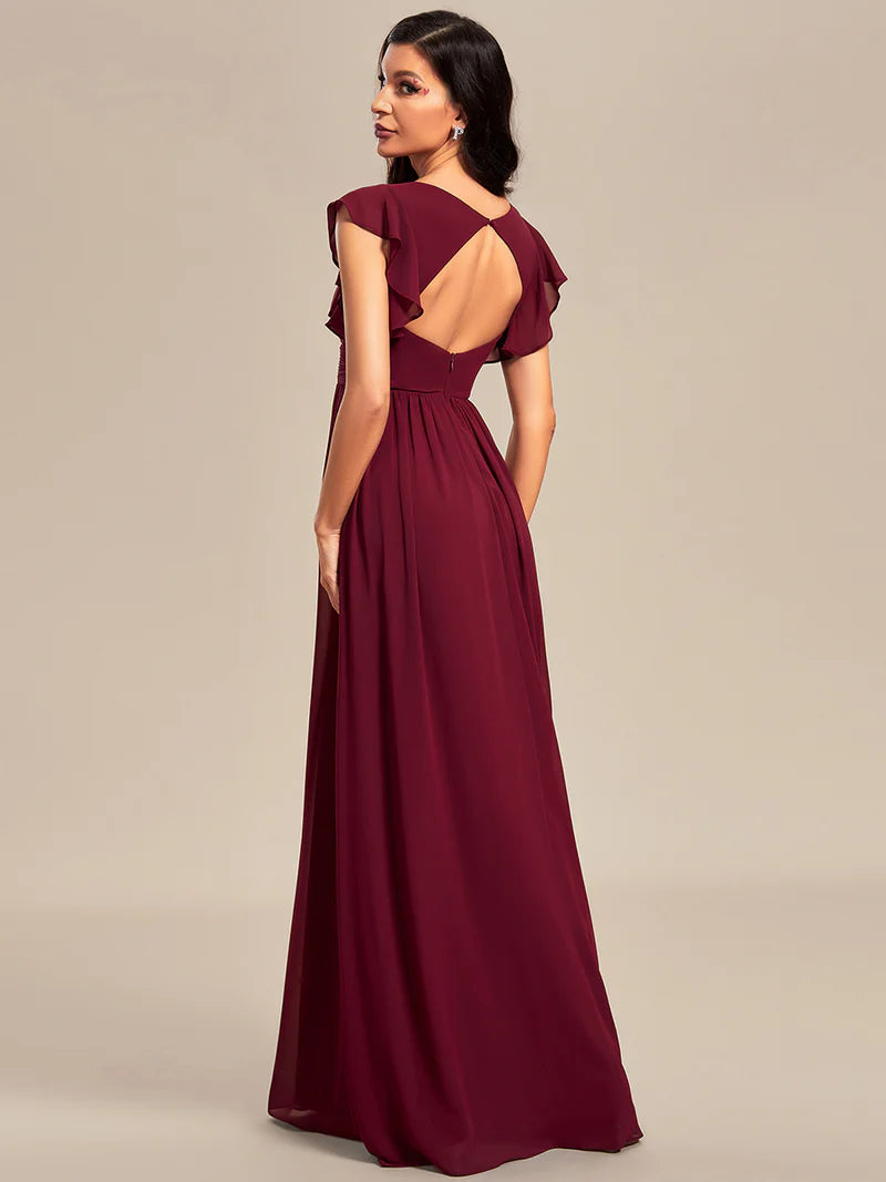 Burgundy bridesmaid dress with ruffle sleeve and open back detail.
