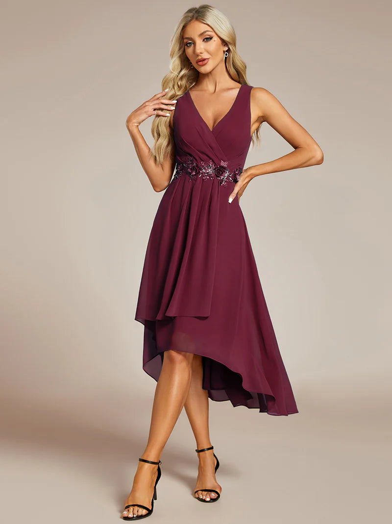 Burgundy cocktail formal dress in chiffon with applique detail and sleeveless.
