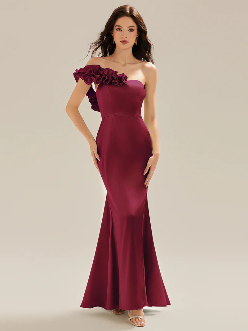 Burgundy strapless formal dress with fishtail and ruffles.