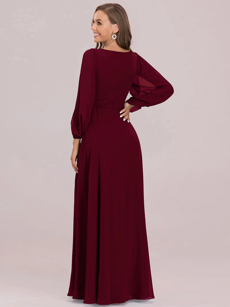 Burgundy long sleeve chiffon formal dress with applique detail.