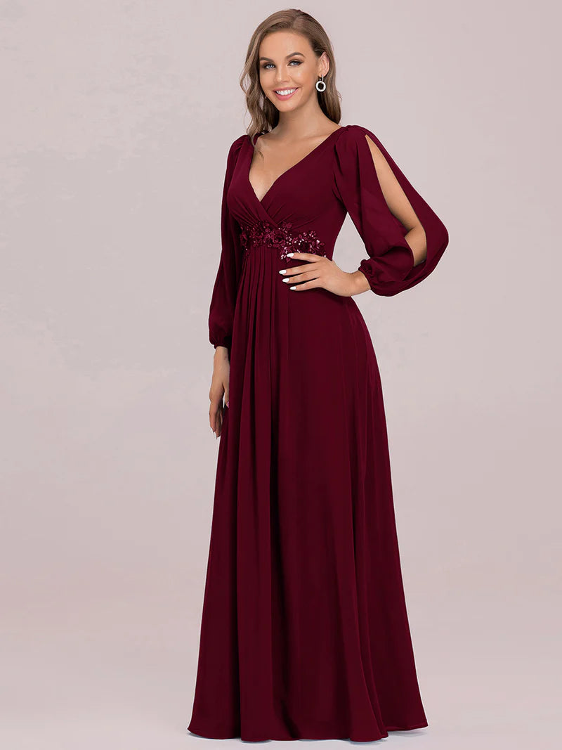 Burgundy long sleeve chiffon formal dress with applique detail.
