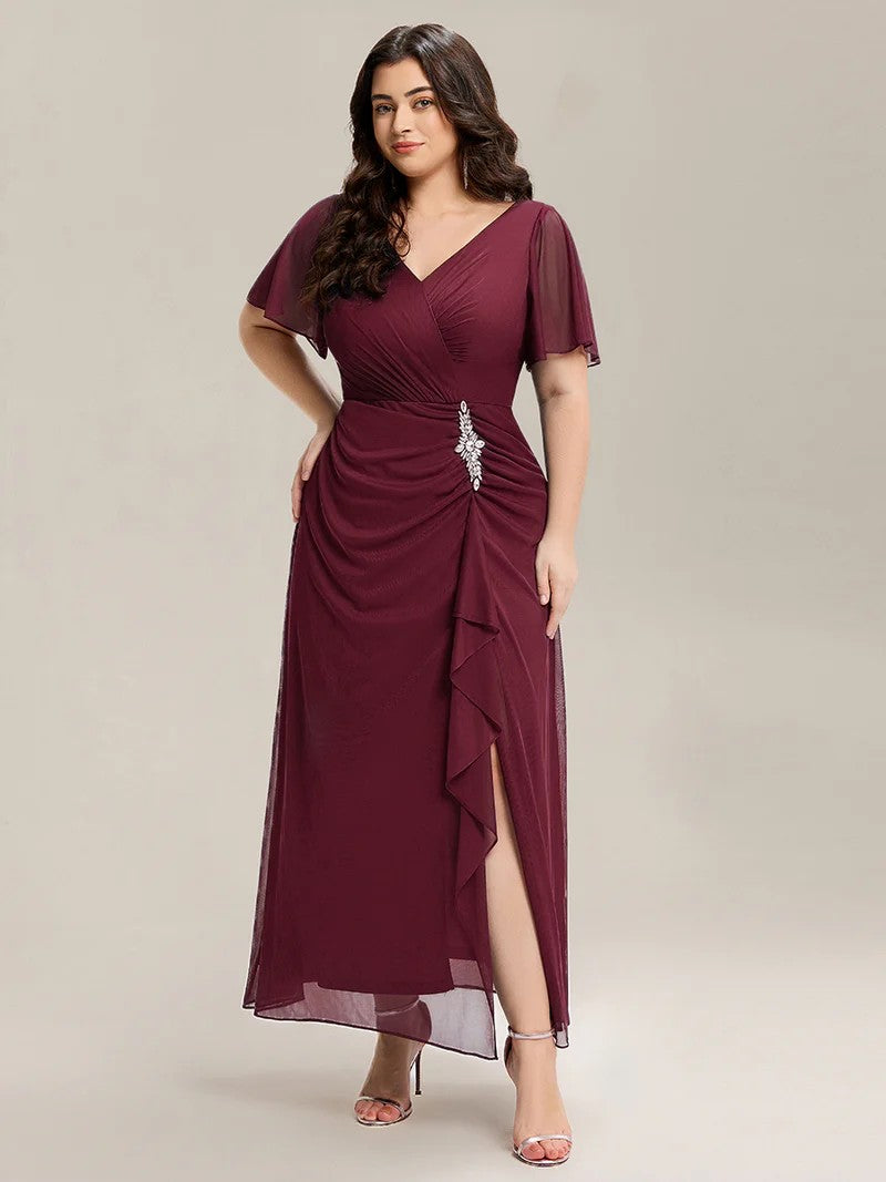 Burgundy plus size wedding guest dress with rhinestone embellishment.