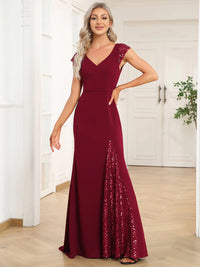 Burgundy red formal or evening dress with cap sleeves, lace and sequin insert with mermaid tail.