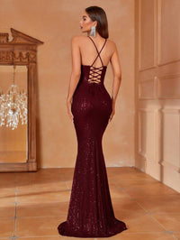 Burgundy red formal dress with lace up back and sequins.