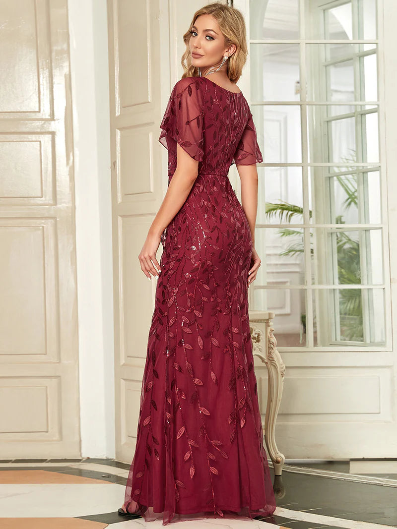 Burgundy red mother of the bride dress with tulle, sequins and lace ruffle sleeves.