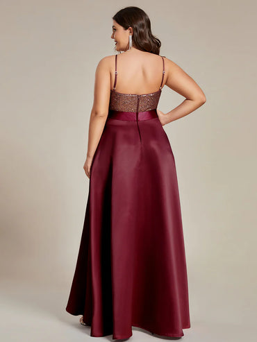 Burgundy red plus size hi low sleeveless satin formal or mother of the bride dress with bodice detailing.