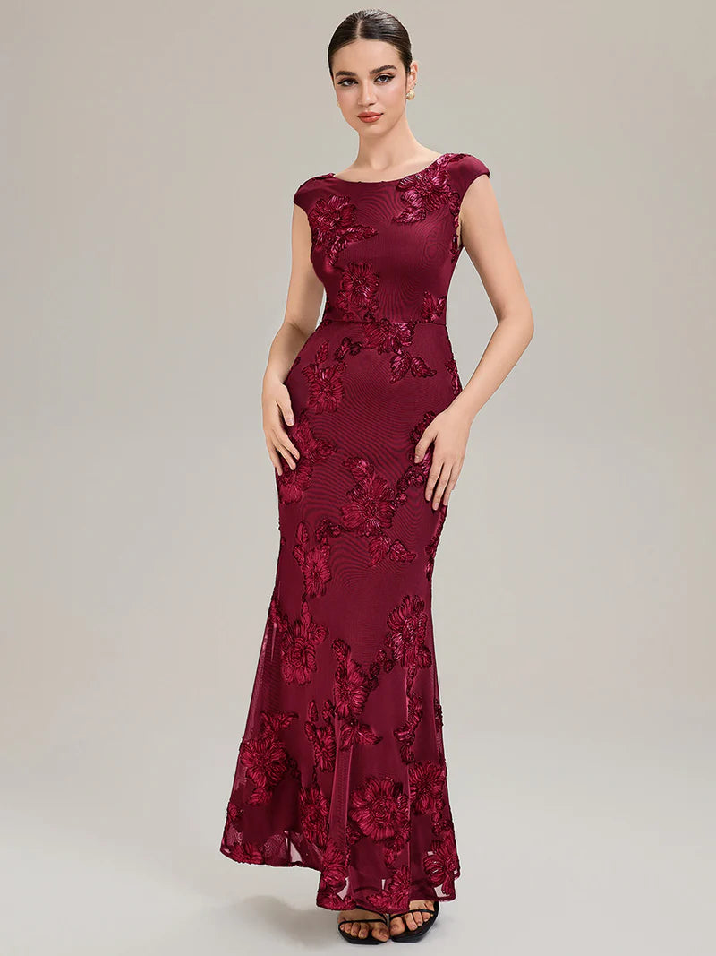 Burgundy mother of the bride dress with ribbon detail and sheath mermaid style.