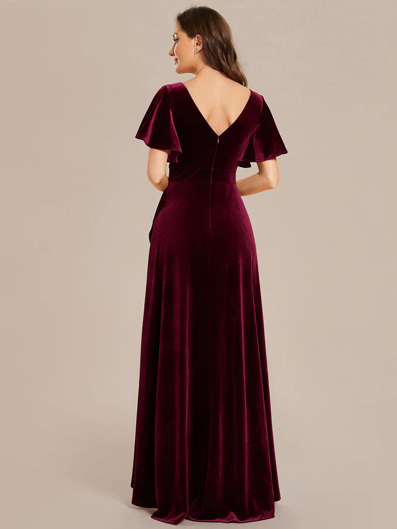Burgundy velvet formal dress with asymetric hem.
