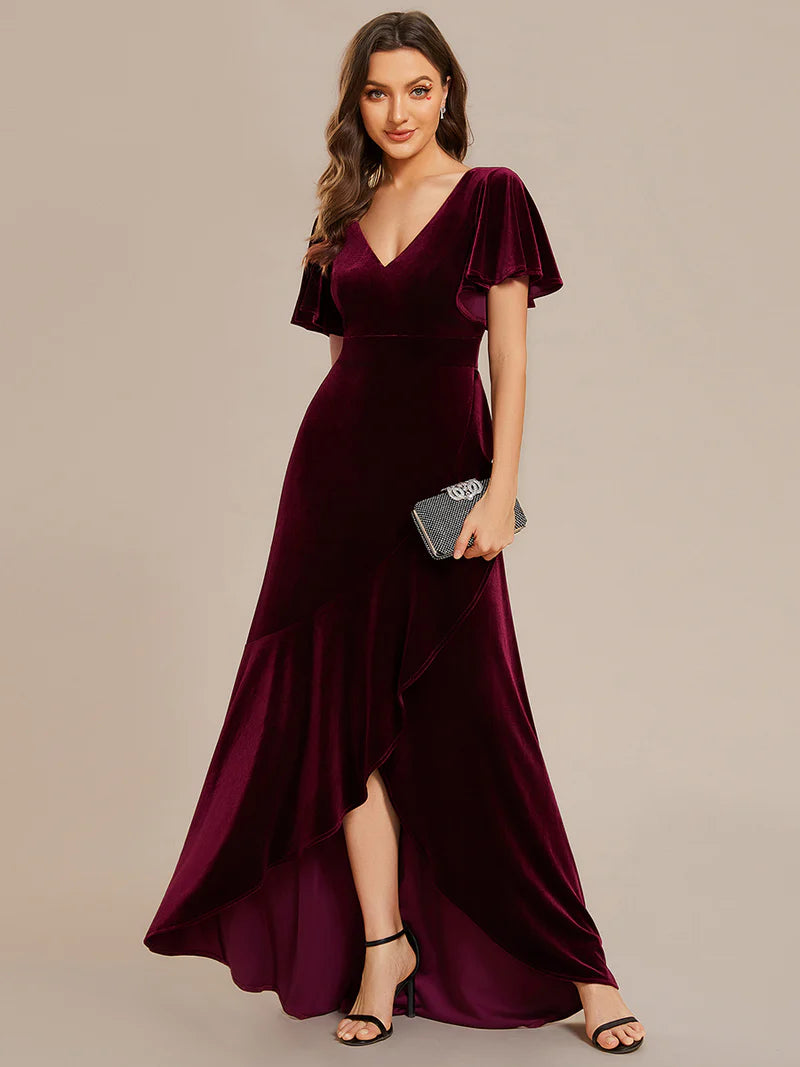 Burgundy velvet formal dress with asymetric hem.