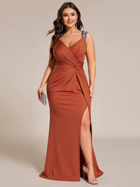 Burnt orange plus sized formal dress with glitter and split front.