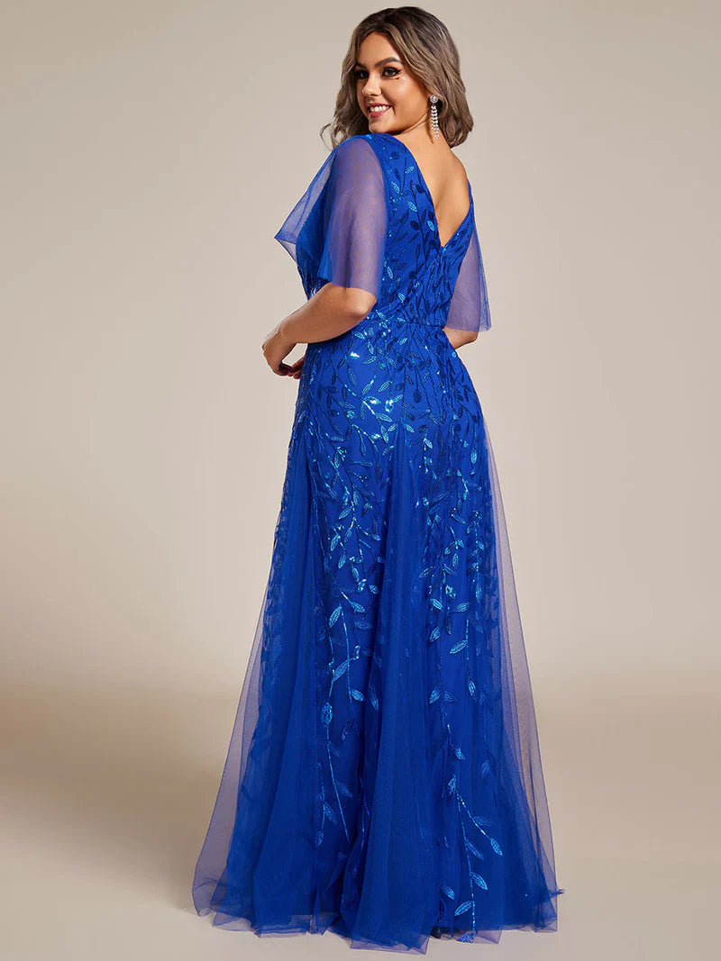 Cobalt blue plus size mother of the bride dress with short sleeves and flowing tulle.