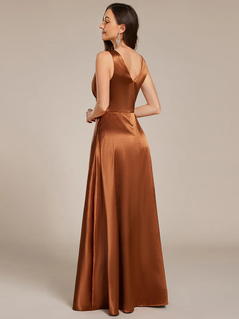 Copper satin bridesmaid dress with v-neck and pockets.