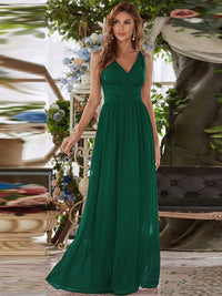 Dark green bridesmaid dress with double v-neck and chiffon.