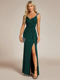 Dark green formal dress with glitter and split front.