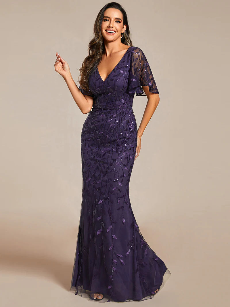Deep purple mother of the bride dress with tulle, sequins and lace ruffle sleeves.