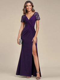 An elegant plus size mother of the bride long deep purple applique cap sleeved evening dress, ruched at the middle.