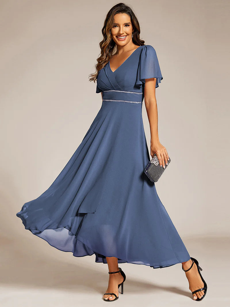 Dusty Blue A-line mother of the bride dress with a sequin band detail and short sleeves.