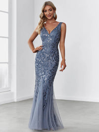 Dusty blue formal dress with fishtail and sequins.