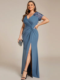 An elegant plus size mother of the bride long dusty blue applique cap sleeved evening dress, ruched at the middle.