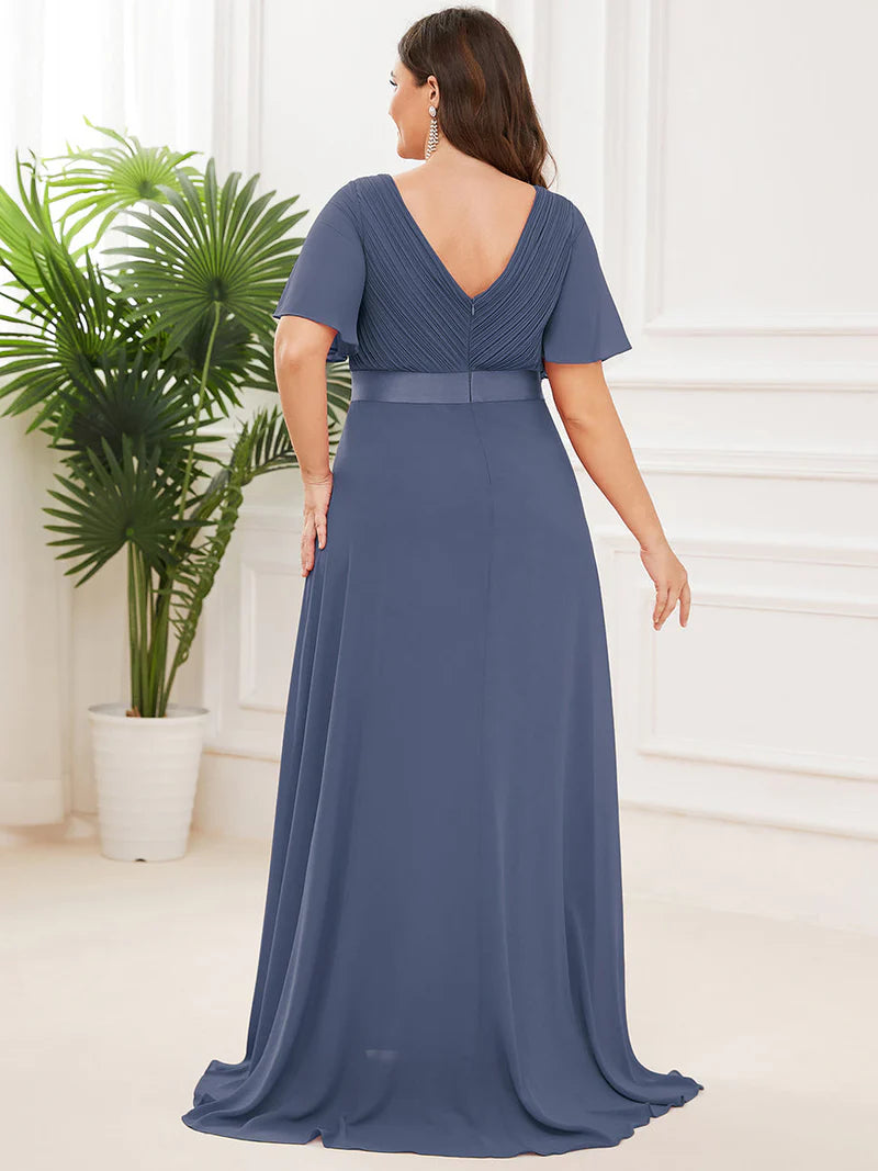 Dusty blue plus size mother of the bride dress in chiffon with short sleeves and a satin band.