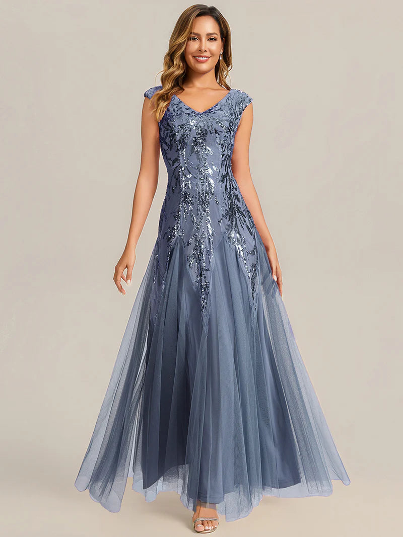 Dusty blue sequin and tulle mother of the bride dress with short sleeve.