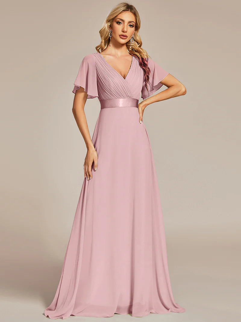 Dusty pink bridesmaid dress or formal dress in chiffon with satin band and short sleeves.