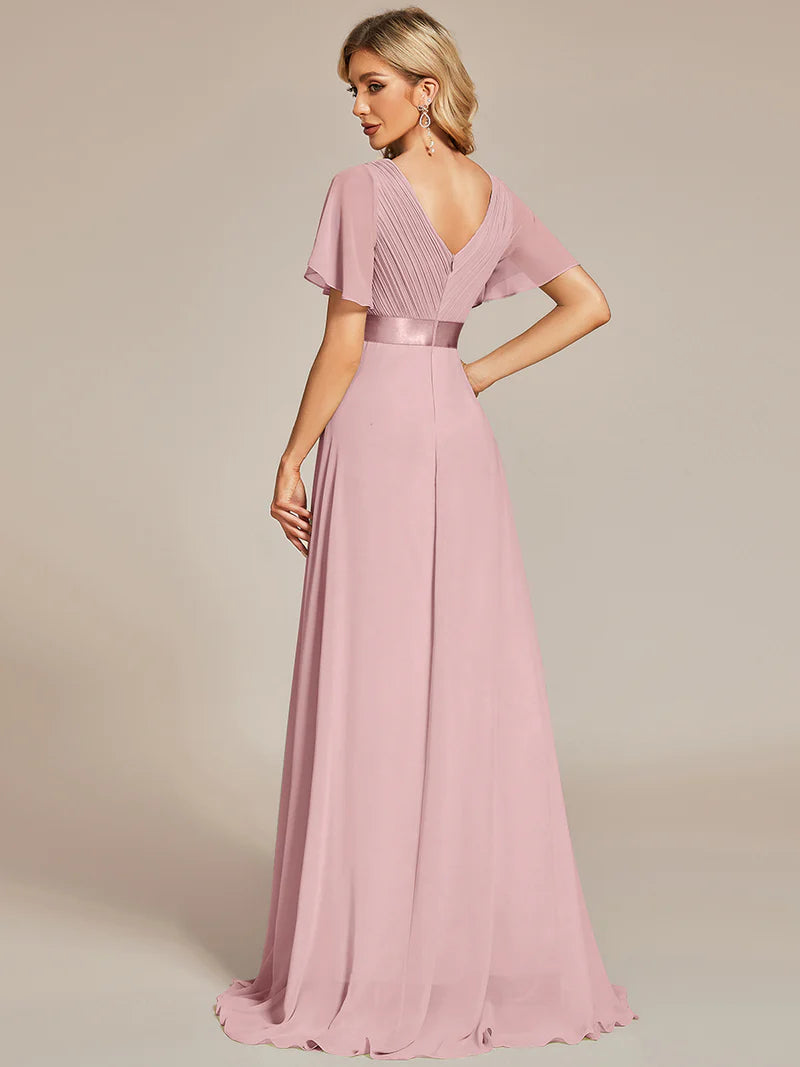 Dusty pink formal dress in chiffon with satin band and short sleeves.