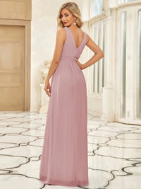 Dusty rose bridesmaid dress with double v-neck and chiffon.