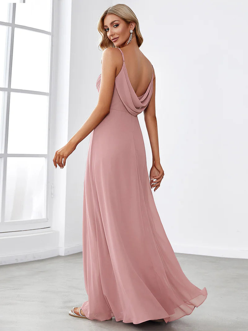 Sleeveless dusty rose bridesmaid dress with spaghetti straps.