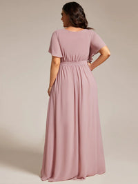 Dusty rose plus sized bridesmaid dress with v-neck and a-line.